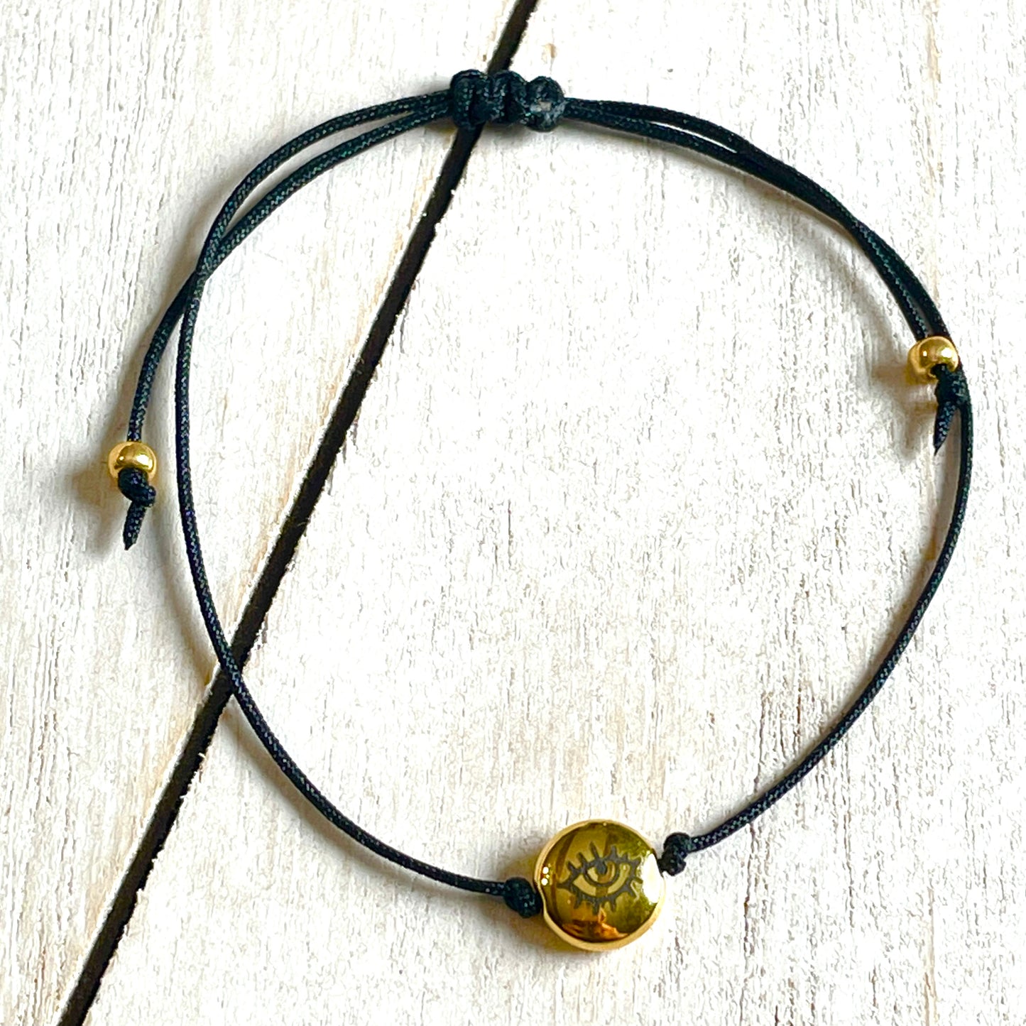 Zugbändchen - Auge - gold